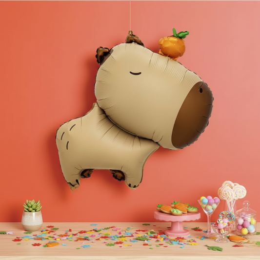 Large 30 inch capybara shaped foil balloon with a small orange on its head for party decoration