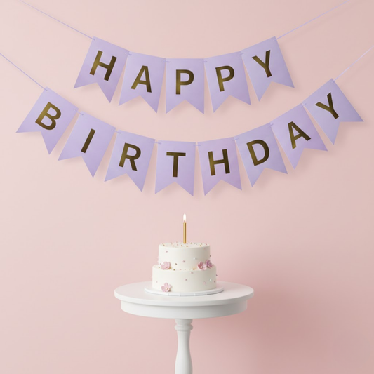 Purple and Gold color Happy Birthday banner with a cake on a pink wall background