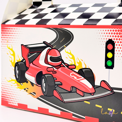 A close-up detail shot of the red Formula One style car illustration on the front of a party favor box, including a traffic light.