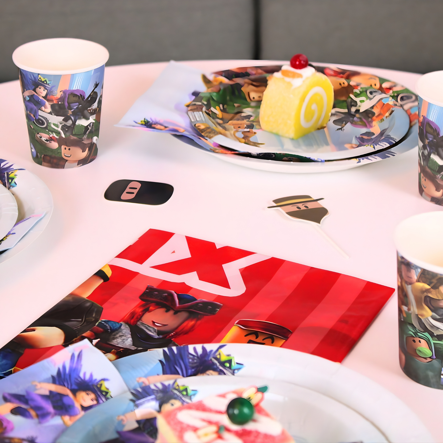 Full Roblox birthday theme kit with plates, cups, napkins, and blue plastic cutlery.